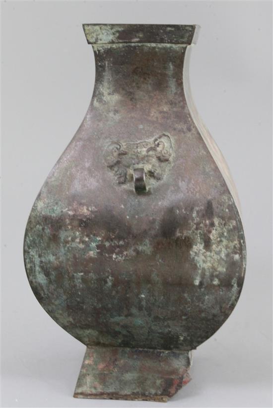 A Chinese archaic bronze wine vessel, Fanghu, Han dynasty, 3rd century B.C-3rd century A.D. , 34cm high, section of foot lacking